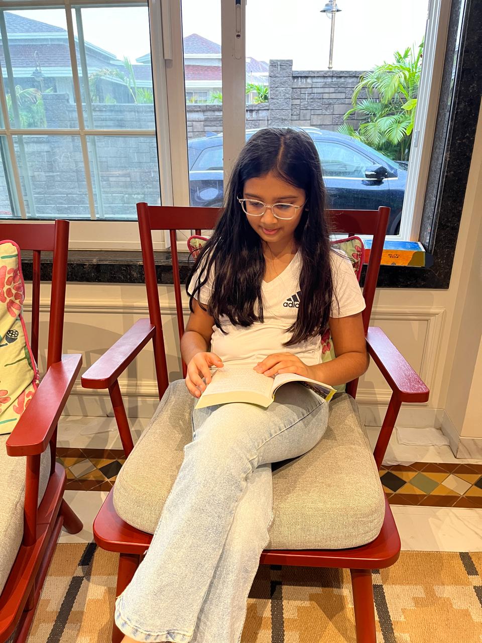 Aarna reading a book